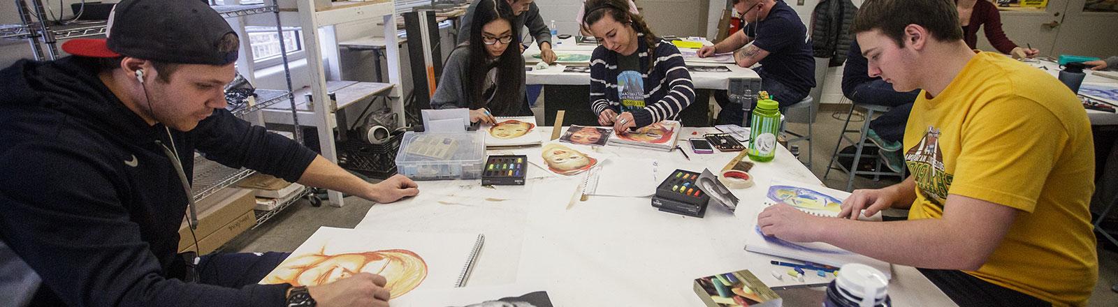 Student working on linocut art